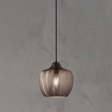 Smoke ribbed pendant with a rounded shade on a grey backdrop
