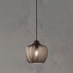 Smoke ribbed pendant with a rounded shade on a grey backdrop