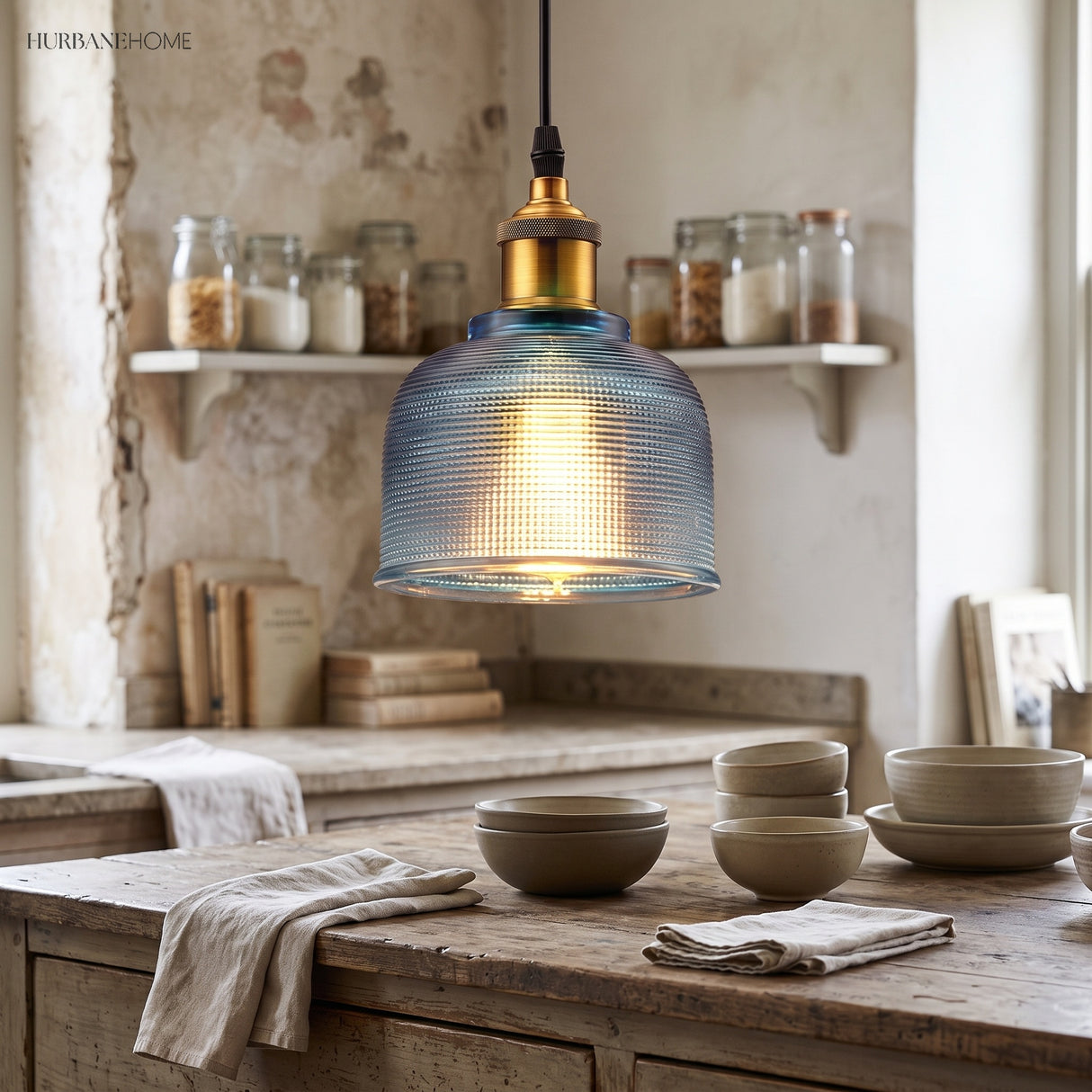 Blue ribbed glass pendant above a rustic kitchen counter