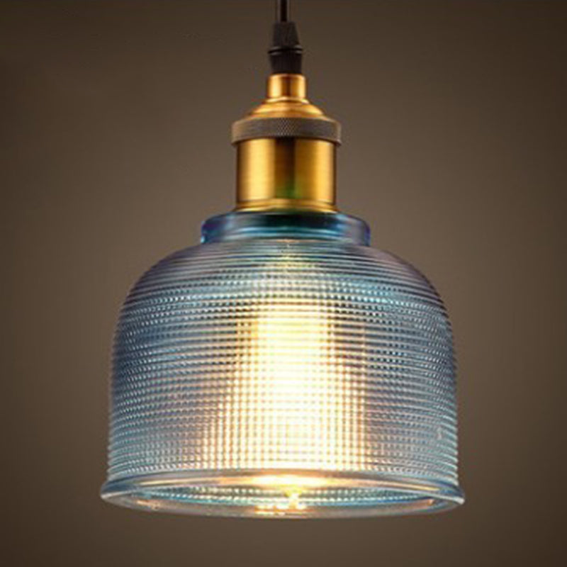 Blue ribbed glass bell pendant with a brass lamp holder