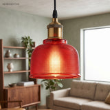 Red bell pendant beside a window in a living room