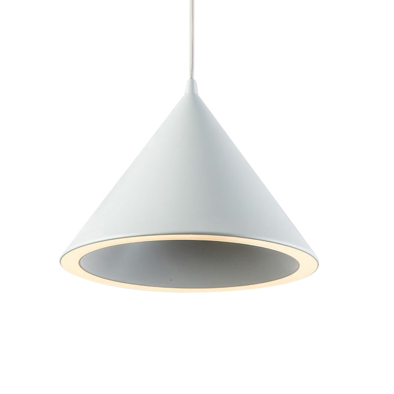 Green cone pendant shade shown lit from below on plain white
