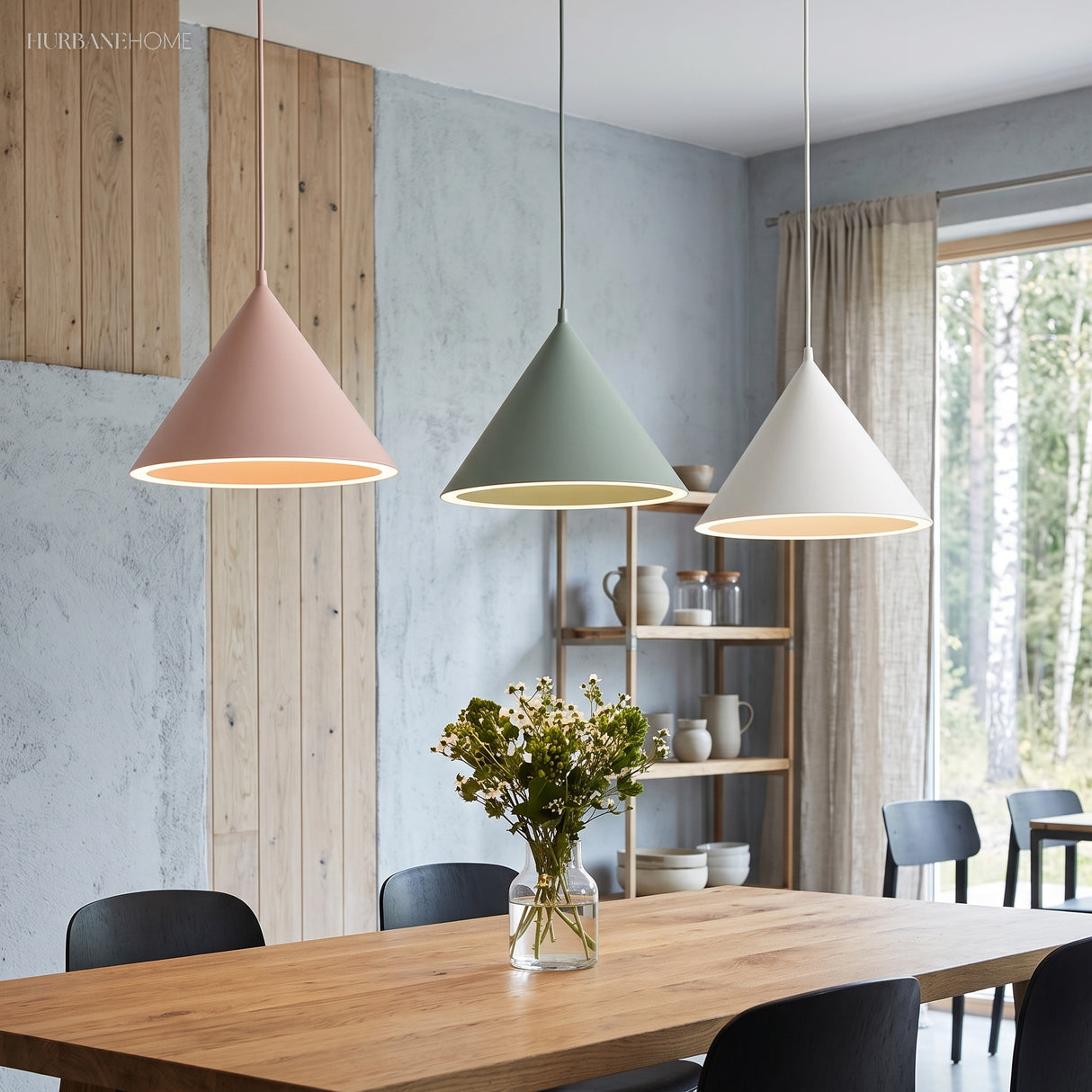 Pink, green and white cone pendants above a long timber table