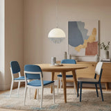 Warm ambient glow from the dome pendant spread across an interior
