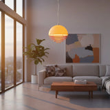 Layered ring pendant lighting a dining area with a soft amber wash