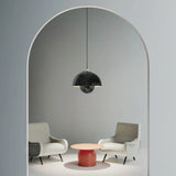 Bud metal pendant light near an entryway with warm ambient light