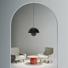 Bud metal pendant light near an entryway with warm ambient light
