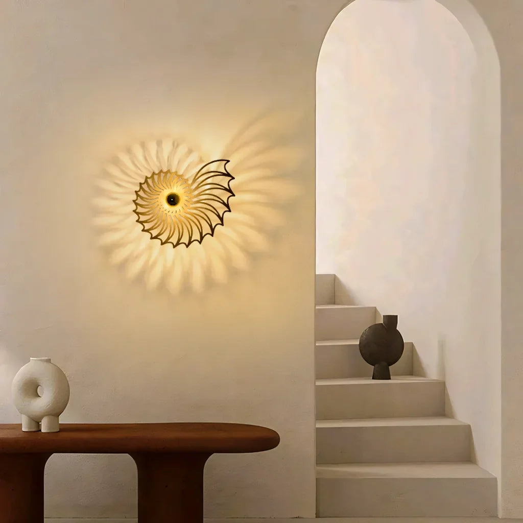 Shell wall light mounted beside a panelled door