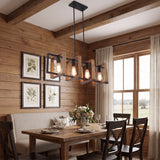 Four light caged farmhouse bar pendant above a table in a timber lined room