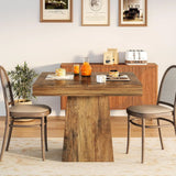 farmhouse pedestal dining table styled for four seats
