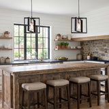 Pair of black cage pendants above a reclaimed timber kitchen island