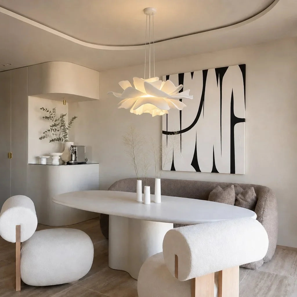 White floral pendant light in a dining room with black and white artwork