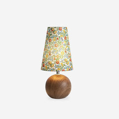 Studio photo of the floral table lamp unlit on a plain white background