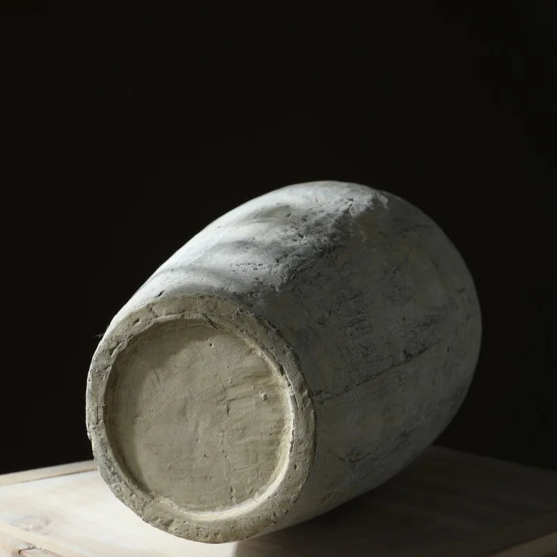 Textured floral ceramic vase on wooden table