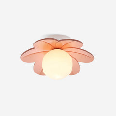 Studio view of the pink petal ceiling light lit, showing the frosted glass globe