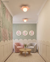 Flower ceiling light in a pale playroom with a picket rail and pink armchair