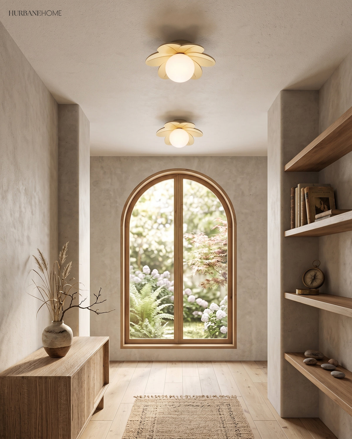 Two flower ceiling lights along a hallway ceiling beside a tall arched window