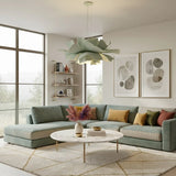 Sage green flower pendant light lit in a lounge with large windows