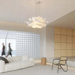 White flower shaped pendant light in a minimalist lounge