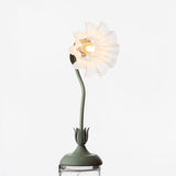Studio view of the shade fanned flat, showing the bulb at its centre