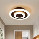 Round ceiling light lit warm on a plain hallway ceiling
