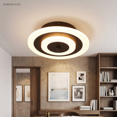 Round ceiling light with a coffee ring lighting a study alcove