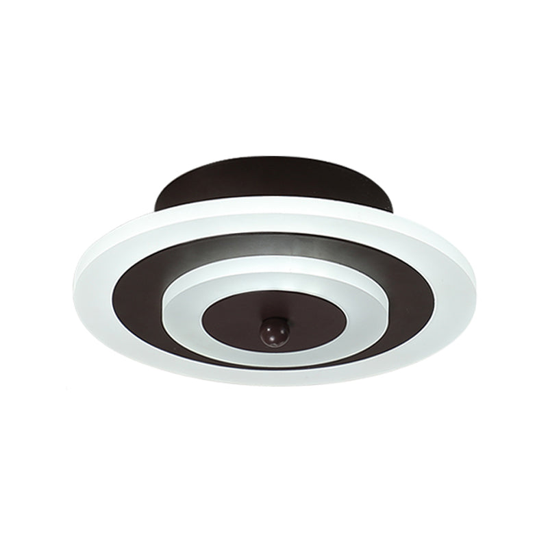 Underside of the round ceiling light showing the coffee center disc