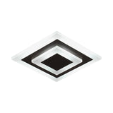 Square white plate with a coffee center seen from a low angle