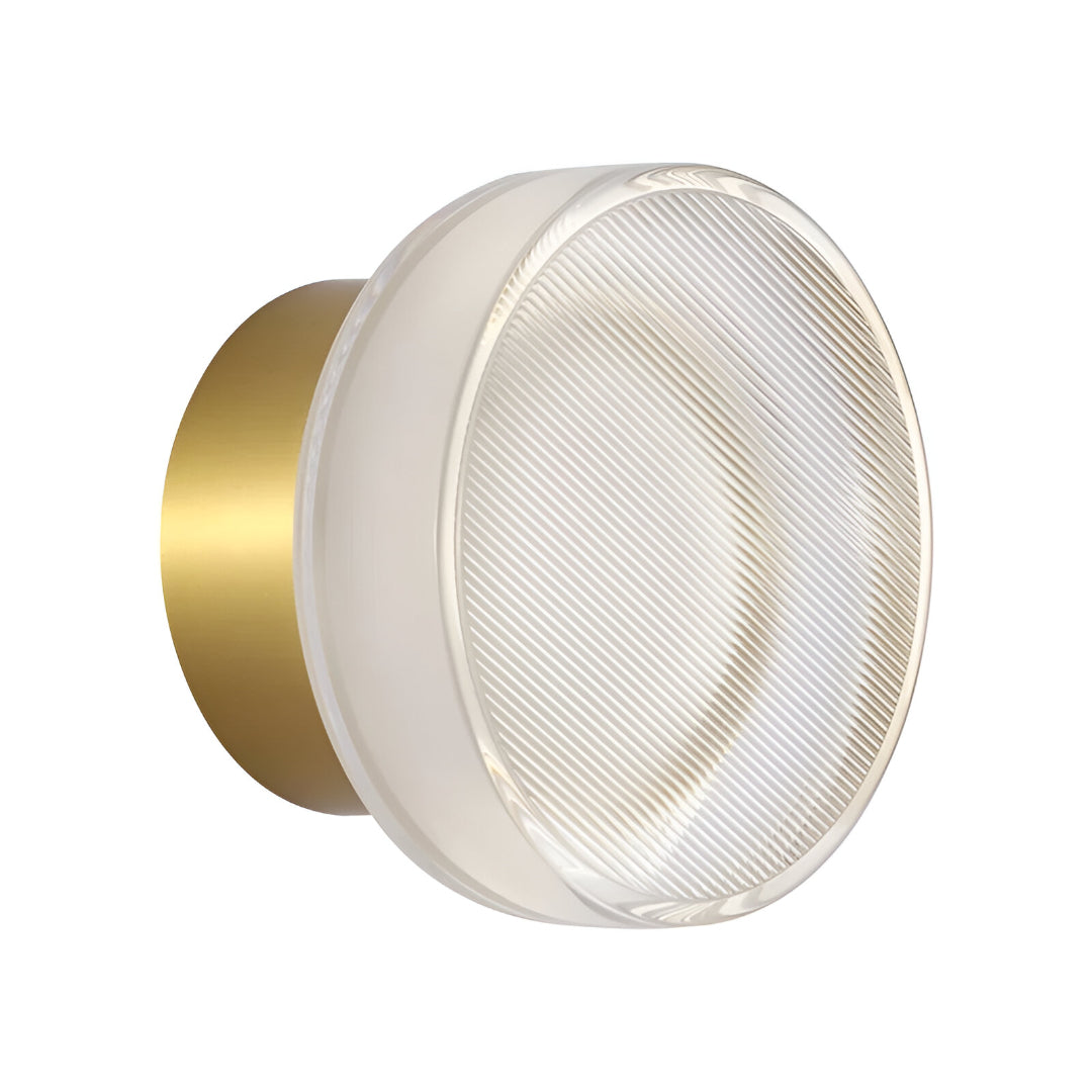 Gold ribbed acrylic wall light photographed alone on a white ground