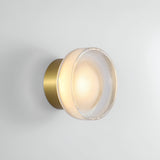 Black ribbed wall light on a plain white wall at an angle