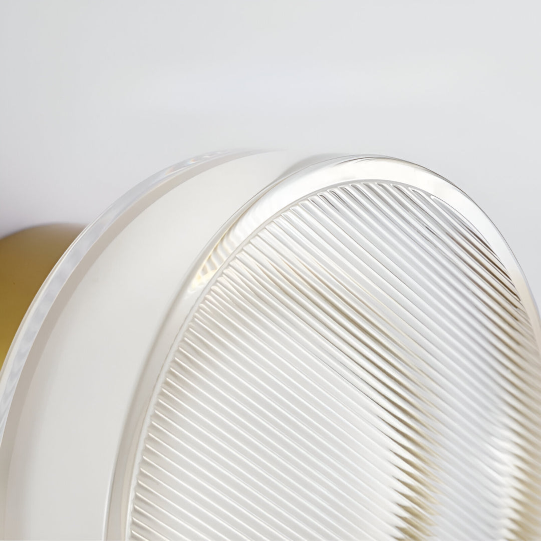 Gold ribbed wall light marked 13cm across and 9cm deep