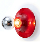 Red disc light lit bright with a mirrored chrome bulb