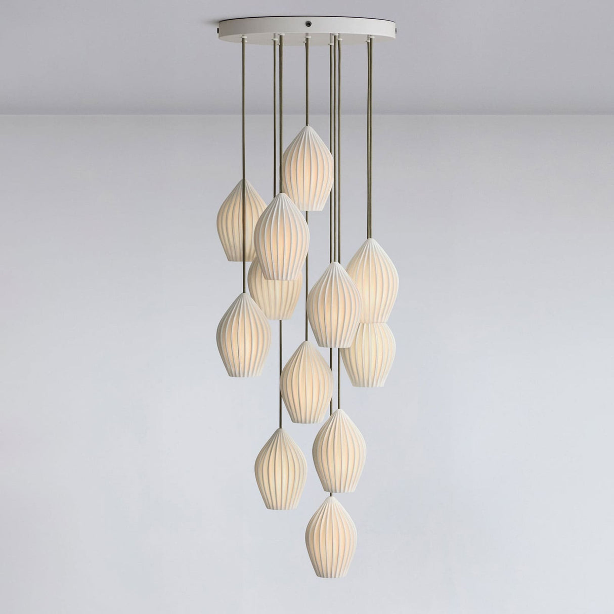 White fluted ceramic pendant light with a ribbed teardrop shade, view 25