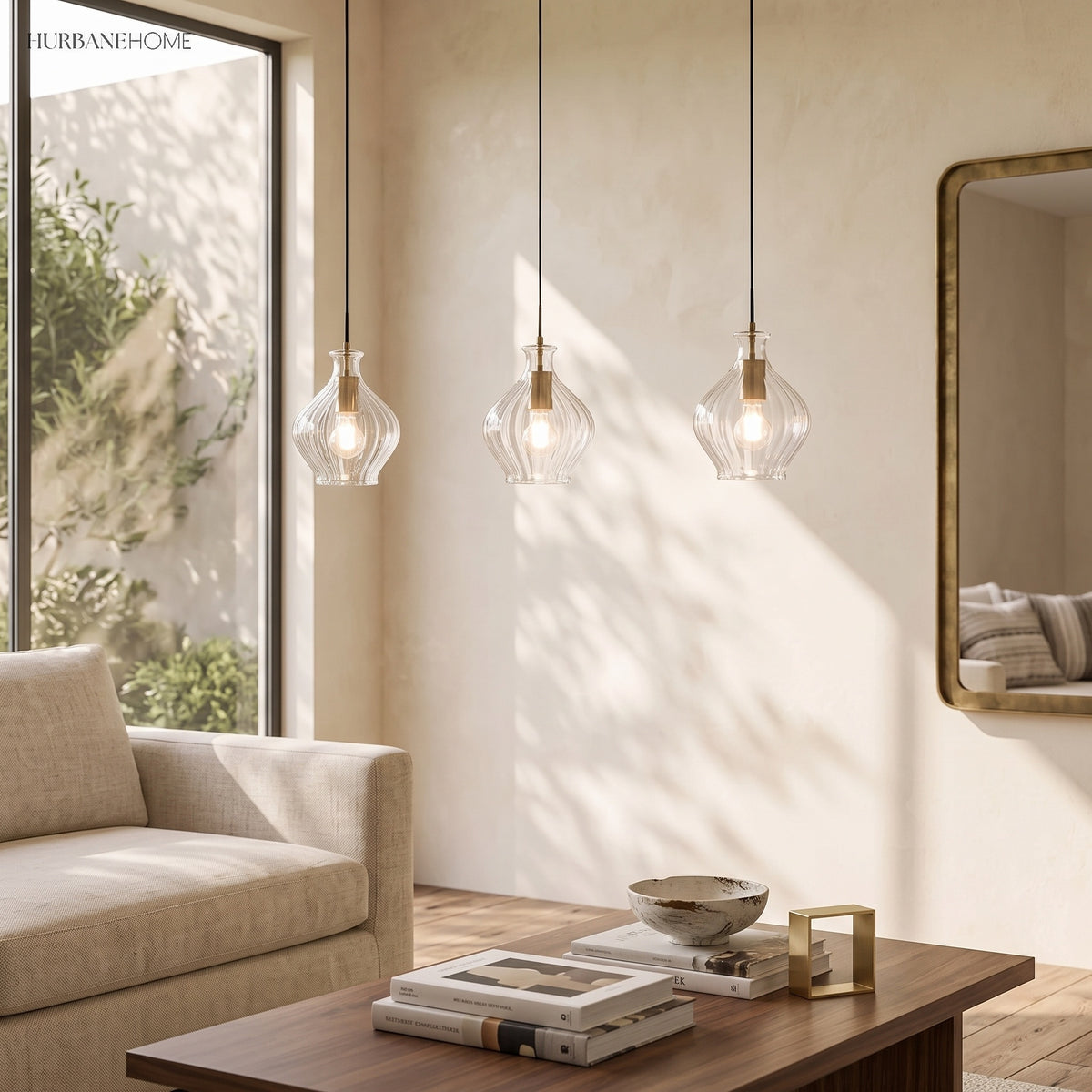Three fluted glass pendants in a row above a light oak dining table