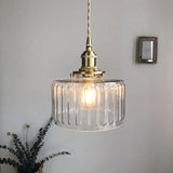 Fluted glass cylinder pendant light with a brass fitting, product view