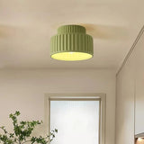 Fluted semi flush mount ceiling light shown switched off on a plain background