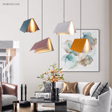Book shaped pendant lights hanging in a styled modern living room