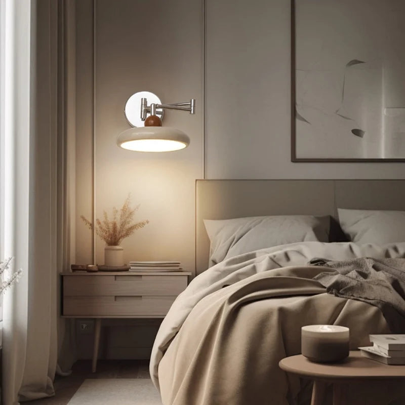 Folding swing arm wall light shown in a partly retracted position