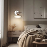 Folding swing arm wall light shown in a partly retracted position