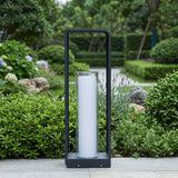 Square frame outdoor lawn bollard light in a garden setting