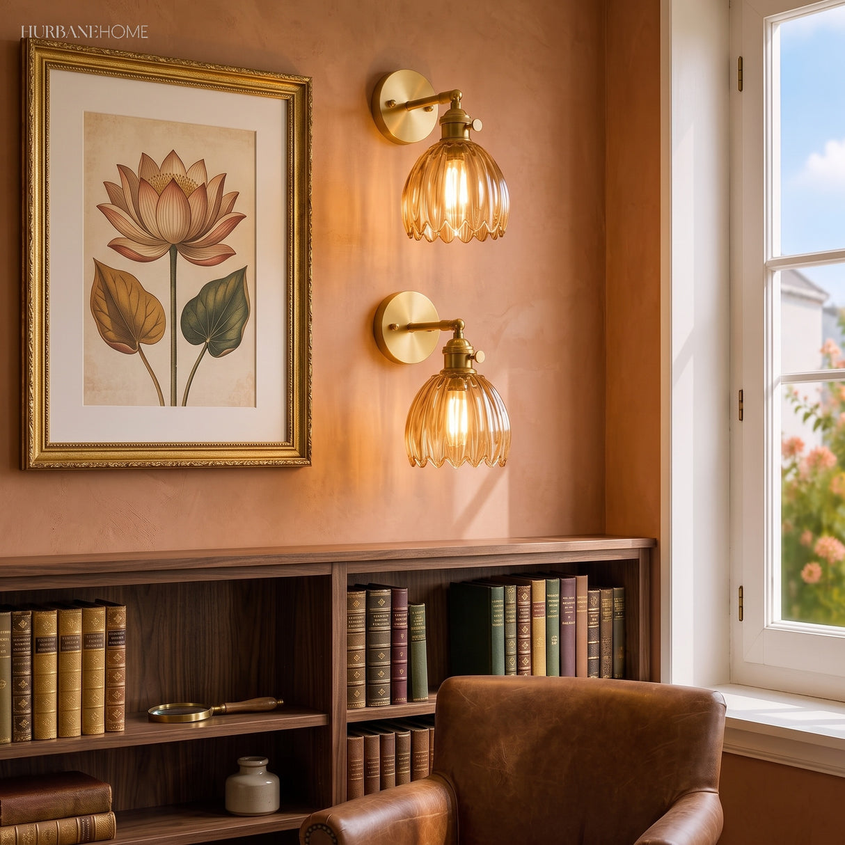 Amber lotus wall sconce on a terracotta wall with botanical art