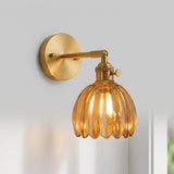 Amber fluted glass lotus wall sconce with brass arm