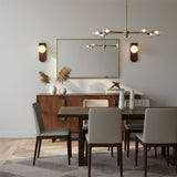 Frosted glass globe wall sconce front facing on light backdrop