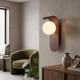 Frosted glass globe wall sconce with curved wood tone backplate