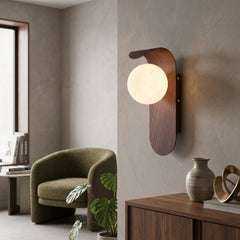 Frosted glass globe wall sconce with curved wood tone backplate