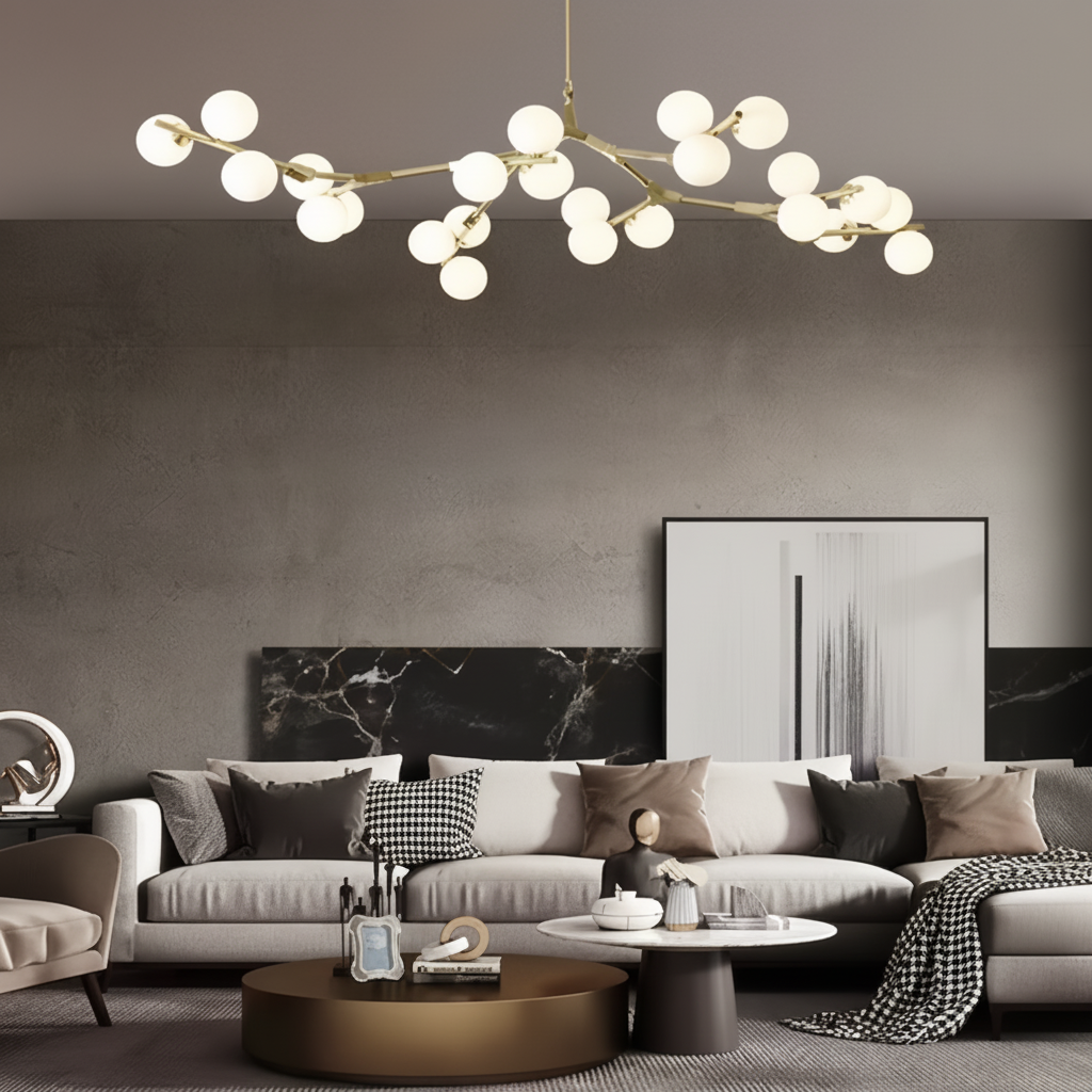Gold branch chandelier above a neutral sofa and round coffee table