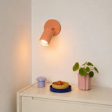 Detail of the frosted spray-painted metal finish on the wall sconce body