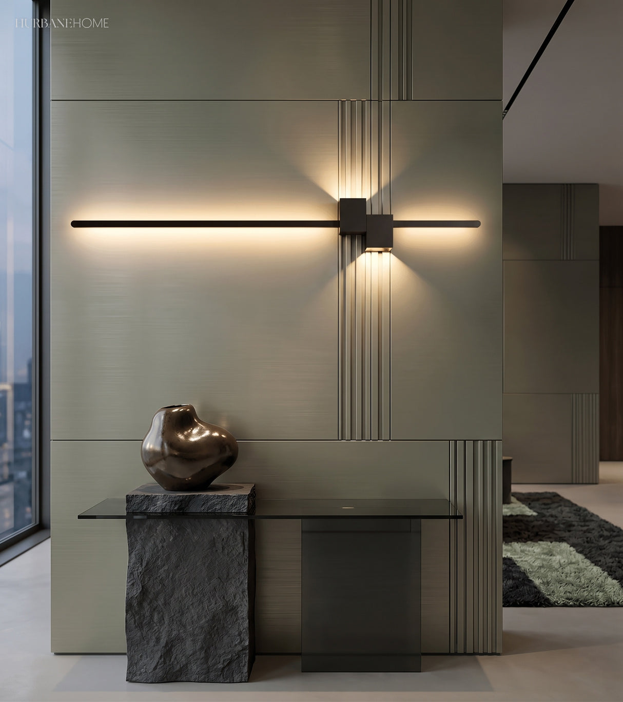 Warm linear wall sconce highlighting a minimalist interior wall