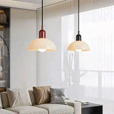 Close view of the glass bowl shade and slim hanging cord