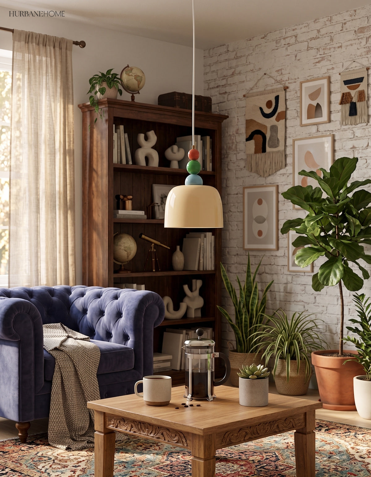 Glass dome pendant lit in a brick walled room with a navy velvet sofa